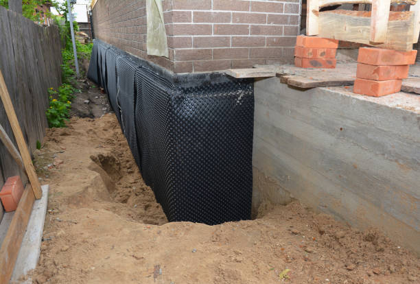SJ Waterproofing Pros technician performing targeted Waterproofing assessment in Lindenhurst, NY
